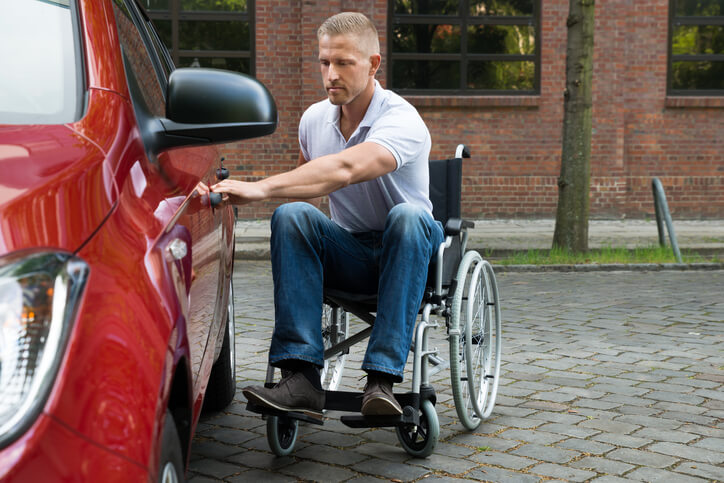 Handicapped Man Opening Door Of A Car